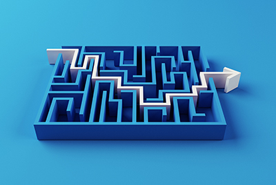 3D image of blue maze with white arrow forging a path to end
